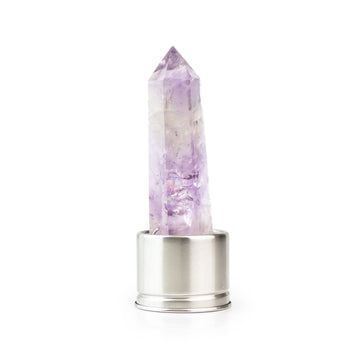 Amethyst attachment for Laterra Gemstone Water Bottle, polished crystal point in metal base on white background.